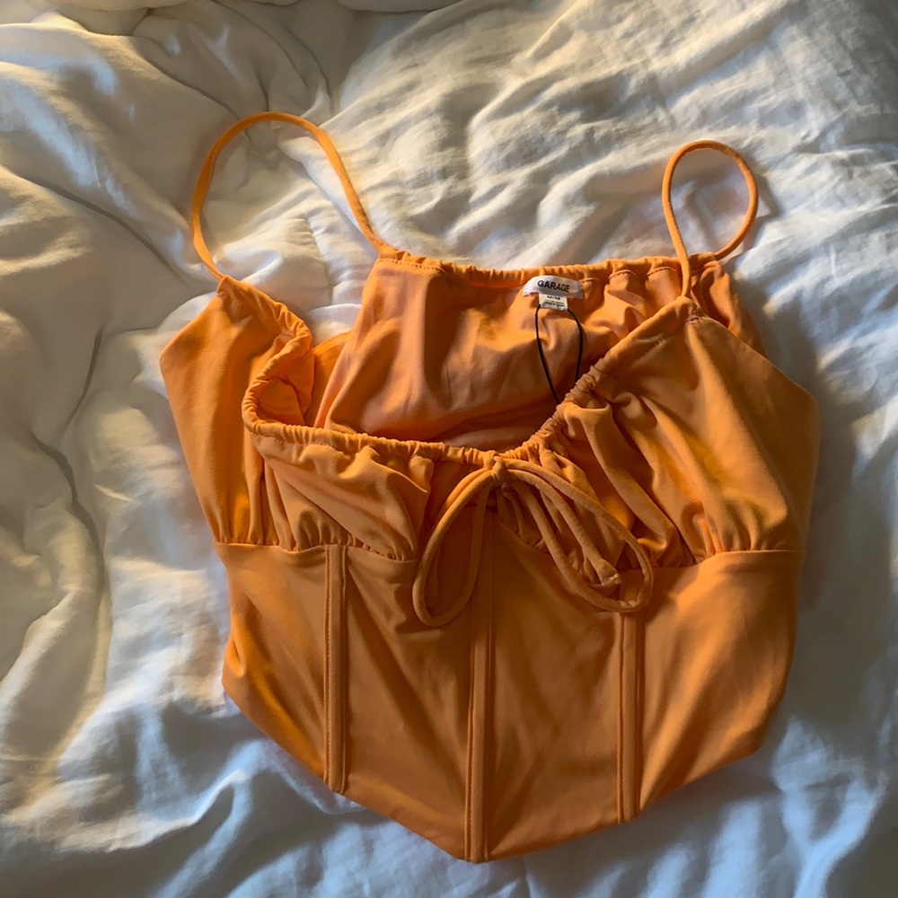Garage orange crop top.